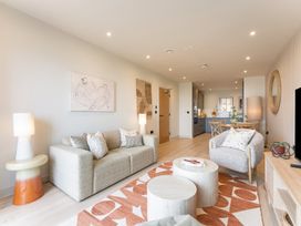 A living room with a sofa and coffee table at Hidden 10- Godrevy View St Ives