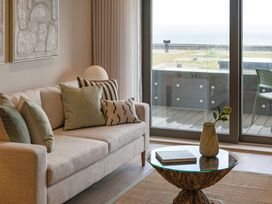 A living room with a sofa and coffee table at tbc in St. Ives