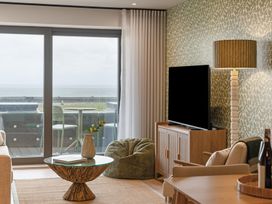 A living room with a television and a bean bag at tbc in St. Ives