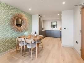 A dining room with a table and chairs at tbc in St. Ives