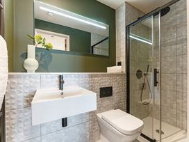 A bathroom with a sink and shower at tbc in St. Ives
