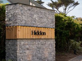 A sign on a stone wall at Hidden 13- Skyline Terrace in St Ives