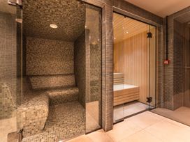 A steam room and sauna area at Hidden 13- Skyline Terrace St Ives