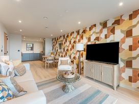 A living room with a sofa and tv at tbc St. Ives