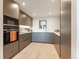 A kitchen with a sink and oven at tbc in St. Ives