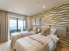 A bedroom with two beds and a view at tbc St. Ives