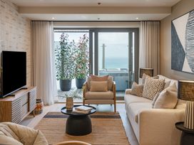 A living room with a sofa and television at tbc in St. Ives