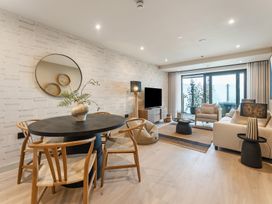 A living room with a dining table and seating area at tbc in St. Ives