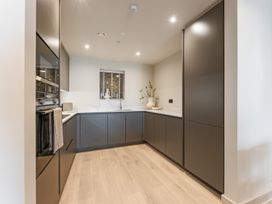 A kitchen with cabinets and a sink at tbc in St. Ives