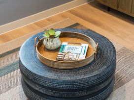 A coffee table with a tray and a plant at tbc St. Ives