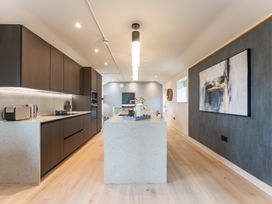 A kitchen with cabinets and an island at tbc in St. Ives
