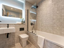 A bathroom featuring a sink, toilet, bathtub and shower at tbc in St. Ives