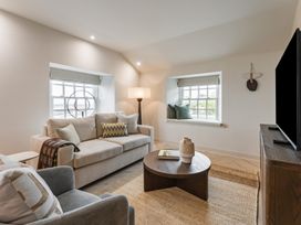 A living room with a sofa and coffee table at tbc in St. Ives