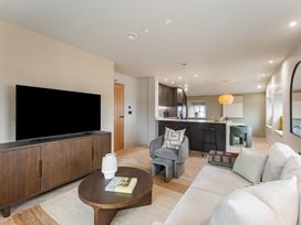 A living room with a television and sofa at tbc St. Ives