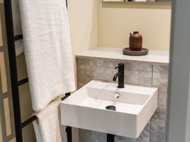 A bathroom with a sink and towels at tbc in St. Ives