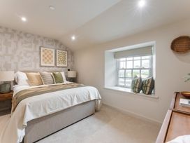 A bedroom with a bed and window at tbc St. Ives