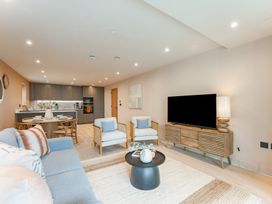 A living room with a sofa and television at tbc in St. Ives
