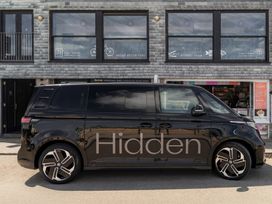 A black van parked outside a restaurant at Hidden 16- Garden Apartment St Ives