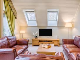 A living room with a television and seating area at The Derwent Spa (Pet) Slaley