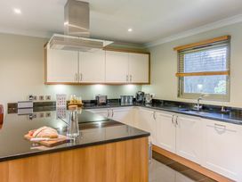 A kitchen with cabinets and countertop at The Derwent Spa (Pet) Slaley