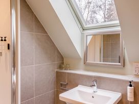 A bathroom with a sink and mirror at The Derwent Spa (Pet) in Slaley