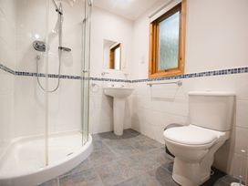 A bathroom with a shower, sink, and toilet at Sidlaw Spa (Pet) Fowlis near Dundee
