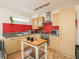 A kitchen with sink and appliances at 7 Blue Water in Bournemouth