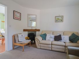 A living room with a sofa and an armchair at Morpeth in Combe St Nicholas