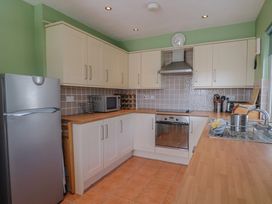 A kitchen with appliances and countertops at Morpeth in Combe St Nicholas