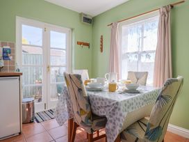 A kitchen with a dining table set for tea at Morpeth in Combe St Nicholas
