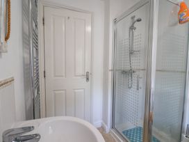 A bathroom with a bathtub and a shower enclosure at Morpeth in Combe St Nicholas