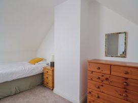 A bedroom with a bed and a chest of drawers at Morpeth in Combe St Nicholas
