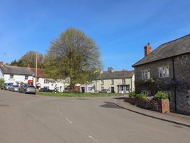 A view of houses and a tree on a street at Morpeth in Combe St Nicholas