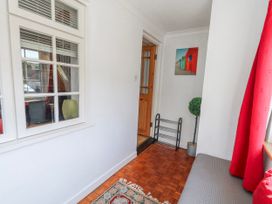 A hallway with a window and a door at 12 West Street Weymouth