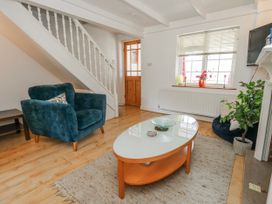 A living room with a coffee table and sofa at 12 West Street in Weymouth