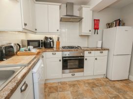 A kitchen with appliances and counter space at 12 West Street in Weymouth