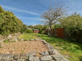 A garden with a gravel area and trees at 12 West Street Weymouth