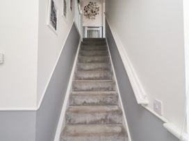 A staircase leading to a landing at 26 Field Court