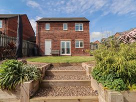 A house with a garden and steps at 26 Field Court
