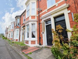 A row of houses with red brick exteriors at 17 Fairfield Road