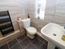 A bathroom with a toilet and sink at 17 Fairfield Road