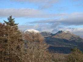 Mountains with snow and trees at 2 Bryn Eglwys Prenteg