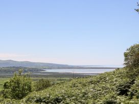 A scenic view of hills and water at 2 Bryn Eglwys in Prenteg