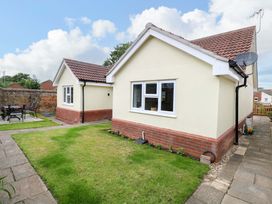 A house with garden and patio area at The Mill House Gardens