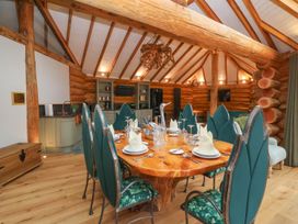 A dining room with a large table and chairs at Copper Suite in Chulmleigh