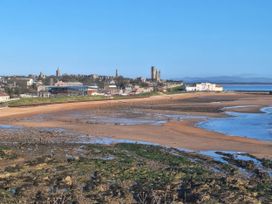 A beach with water and a city view at St Andrews Holiday Park - Taigh na Mara, St Andrews
