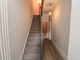 A staircase in a hallway at 5 Station Avenue