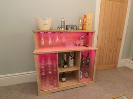 A bar unit with glasses and drinks at 5 Station Avenue