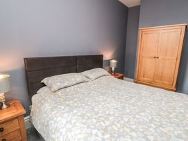 A bedroom with a bed and wardrobe at 5 Station Avenue