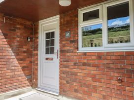 An entrance with a door and window at A5 Bay Apt.